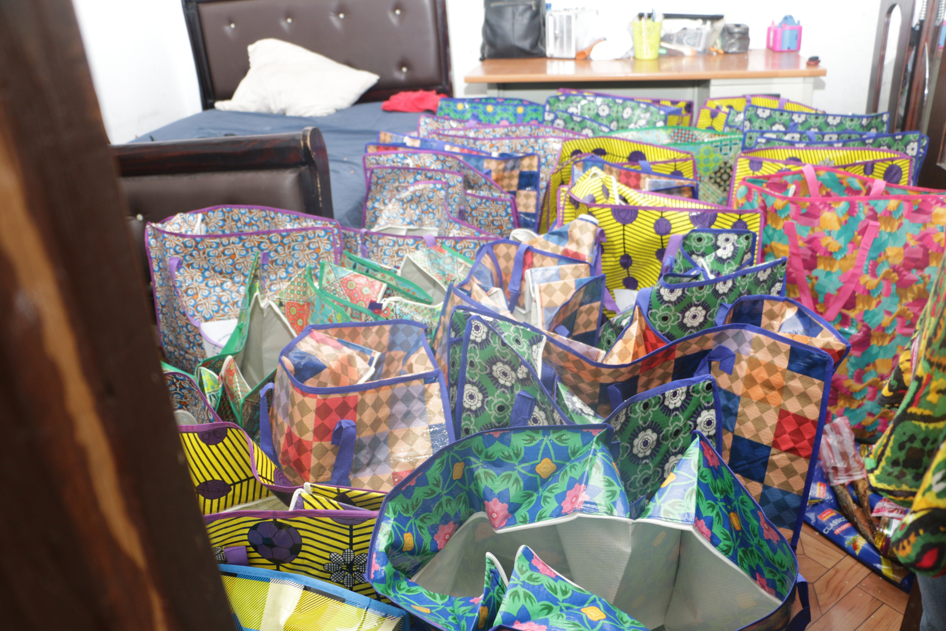 Dozens of colorful bags filled with kits ready for the families