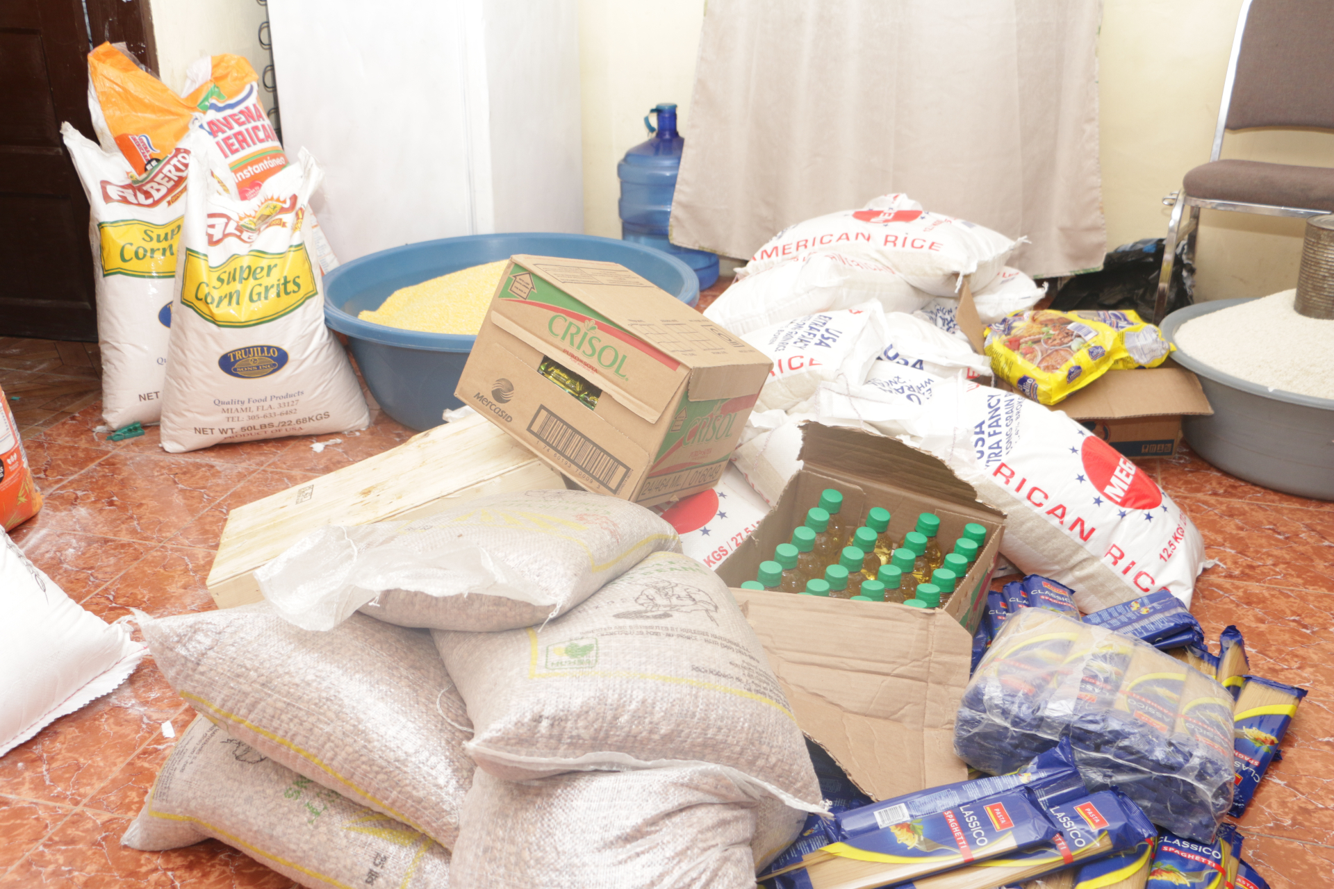 Food supplies: rice, corn, oil and pasta prepared for distribution
