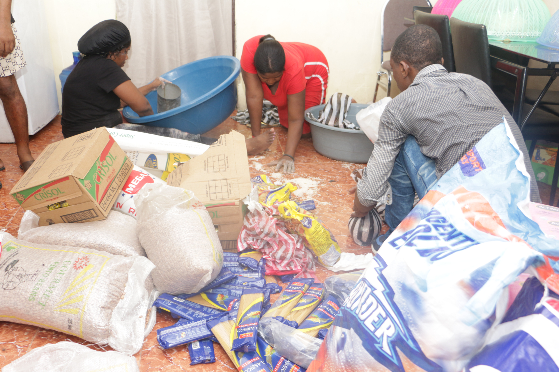 PAV-H team packing rice, oil and pasta for the food kits