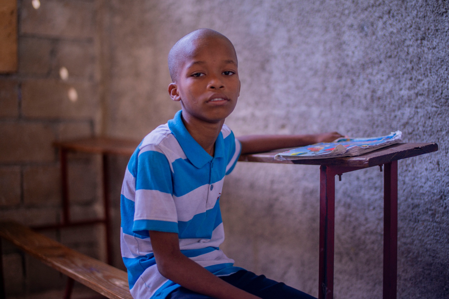 Young boy with his school notebook