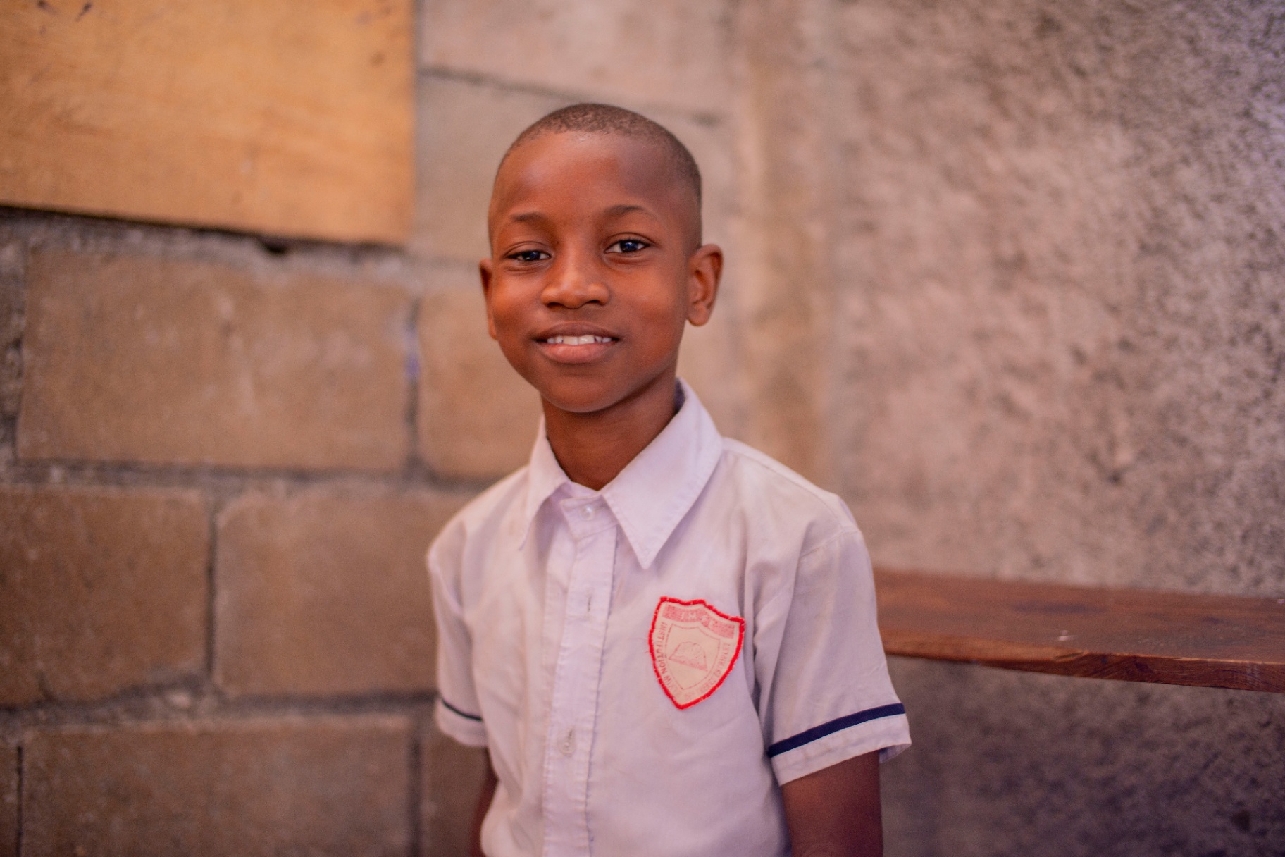 Portrait of a young schoolboy smiling in uniform