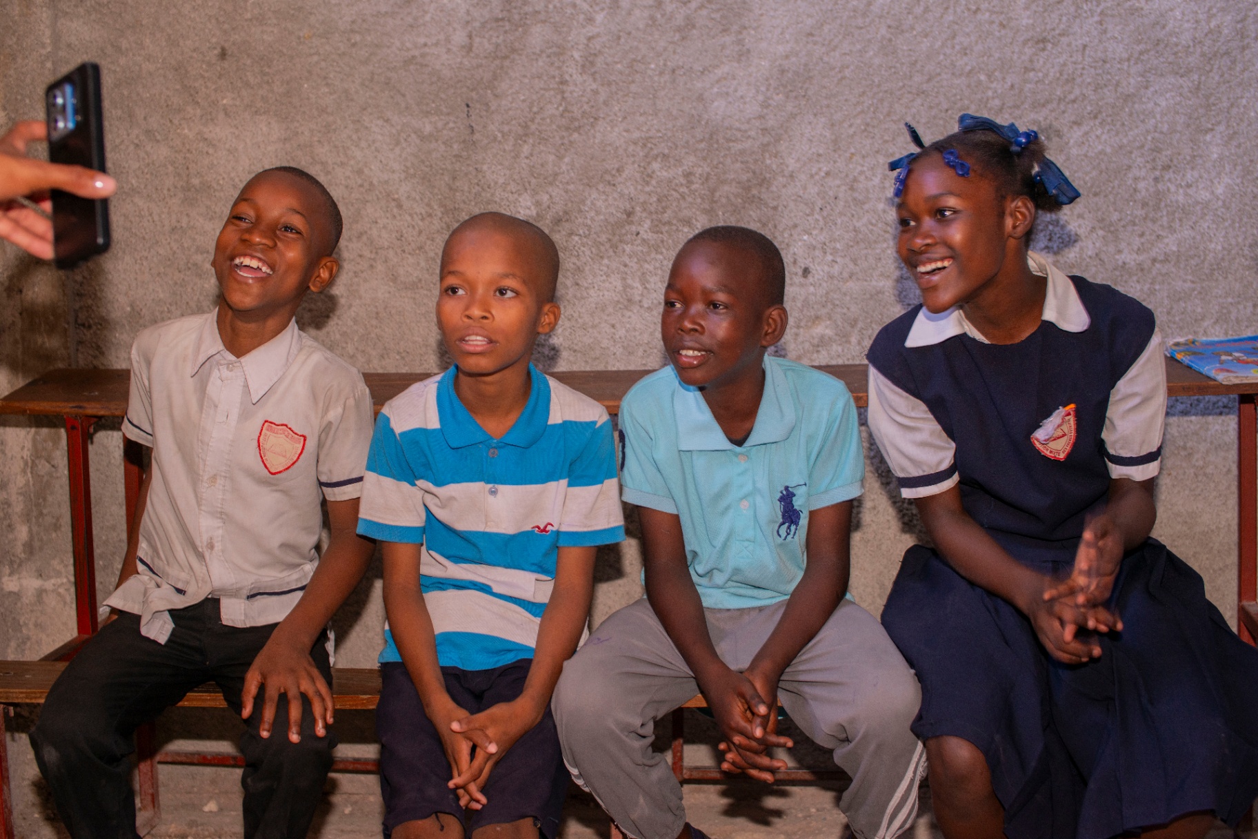 Children laughing in front of the camera during a PAV-H visit